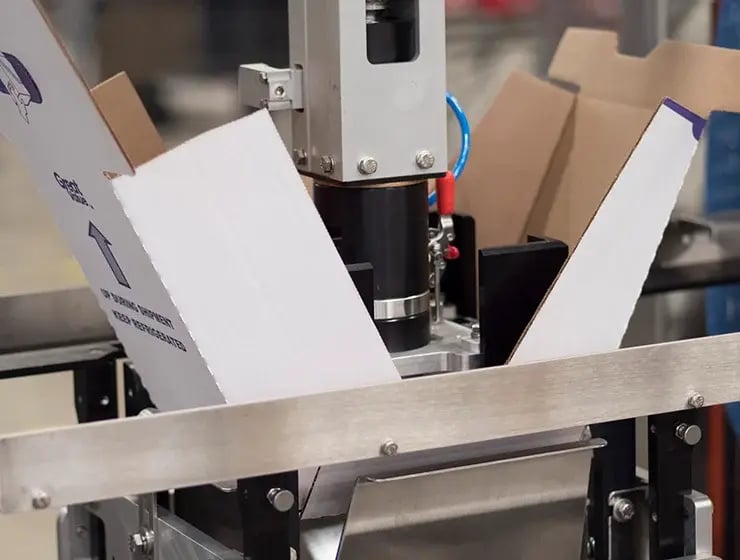 A close up image of the forming head inside of Delkor's Trayfecta G Series Former