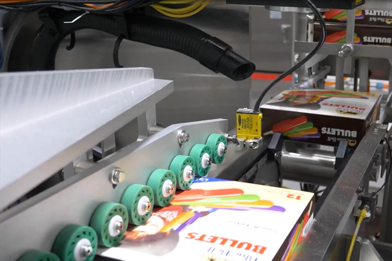 Boxes of ice cream run through Delkor machinery