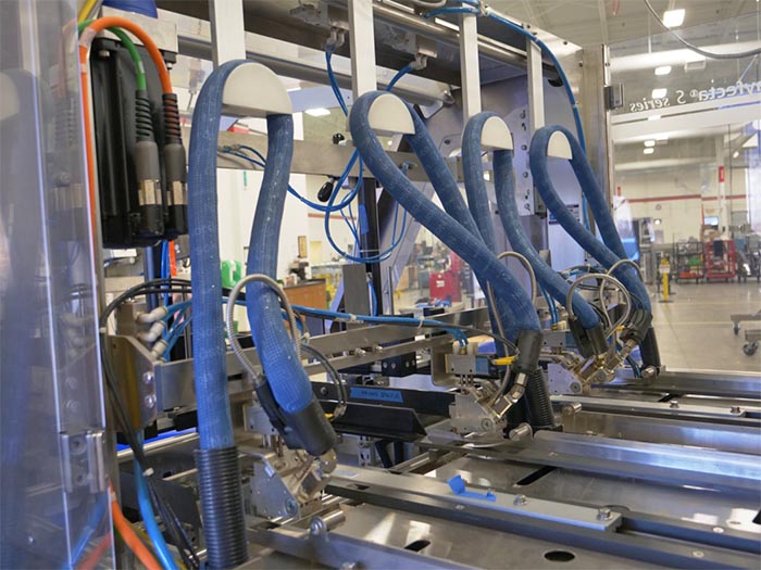 Cartoning equipment internal wiring and hosing