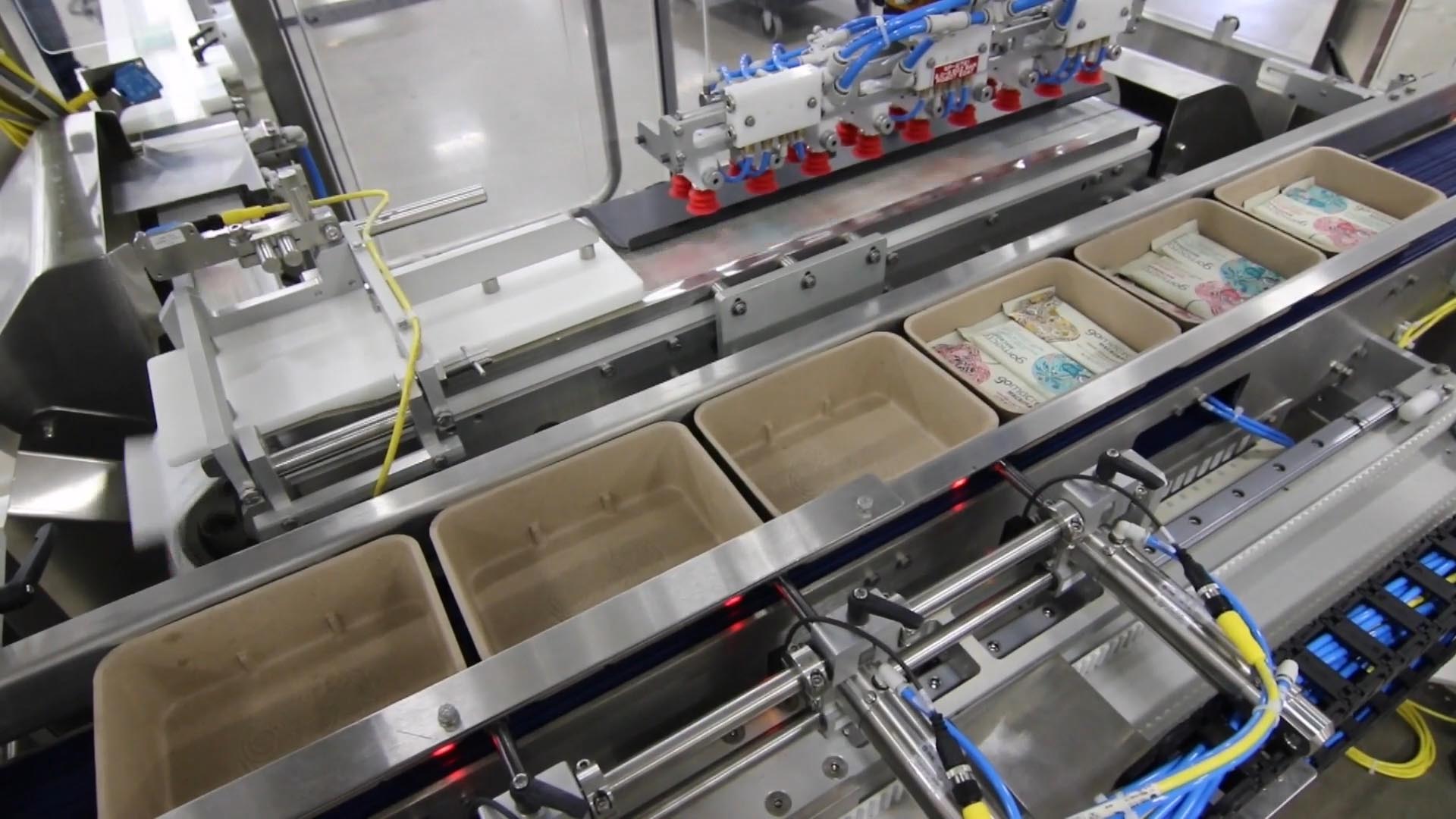 Top load cartoner servo pushers for cartons and trays Top load cartoner servo pushers for cartons and trays