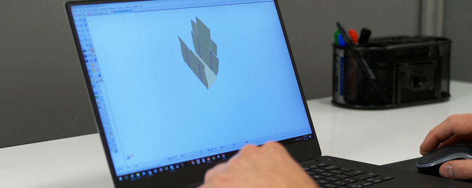 Package Lab at Delkor designing a package sample CAD drawing