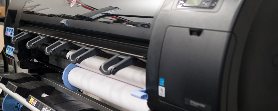 Package Lab at Delkor's industrial printer for custom graphic prints on package samples