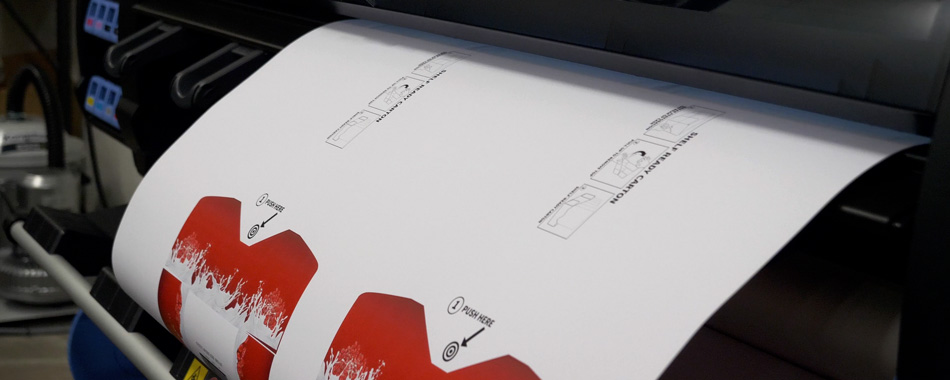 Package lab in Delkor printing custom graphics for a sample package