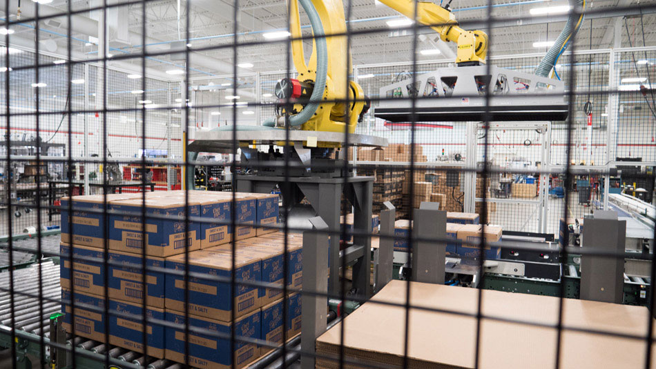 Palletizer stacking cases inside of cage