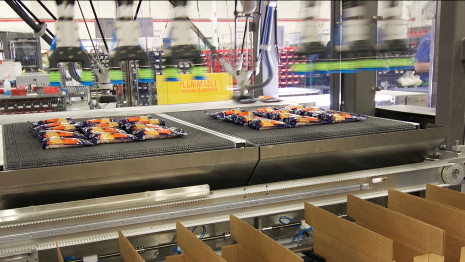 Robotic Case Packer packing at speeds up to 200 pouches per minute. Robotic Case Packer packing at speeds up to 200 pouches per minute.
