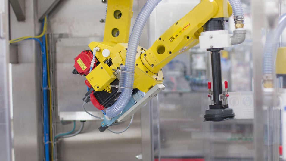 Robotic top loader with integrated FANUC robotics