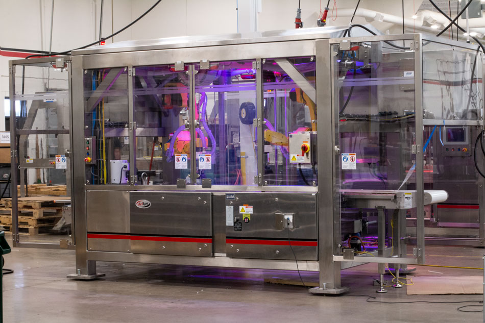 Robotic top loader spective view with stainless steel and LED lights