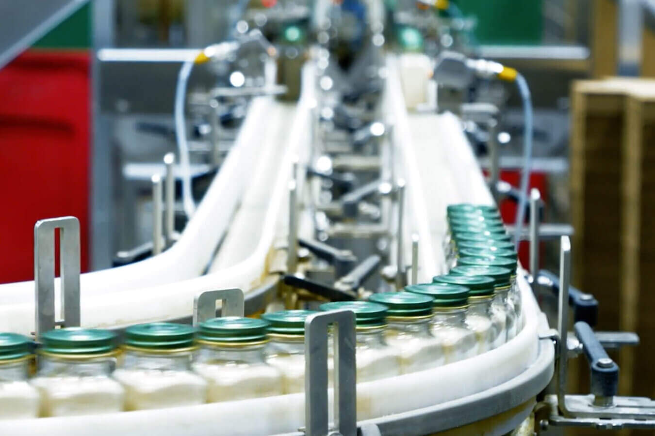 Jars of spices are carried down the production line on one of Delkor's machines