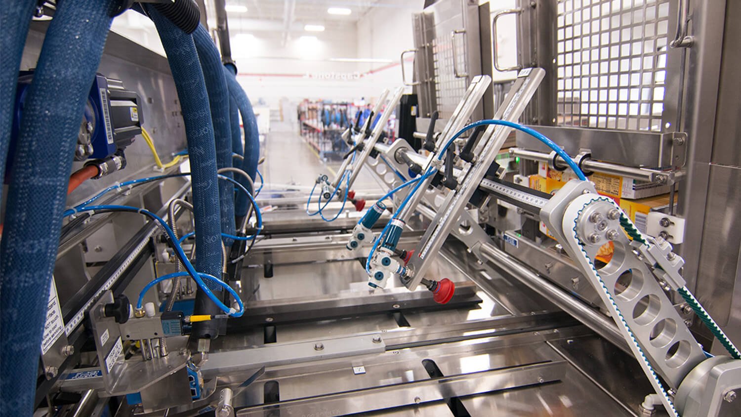 A close-up image of the picker arm on Delkor's L Series Lidder